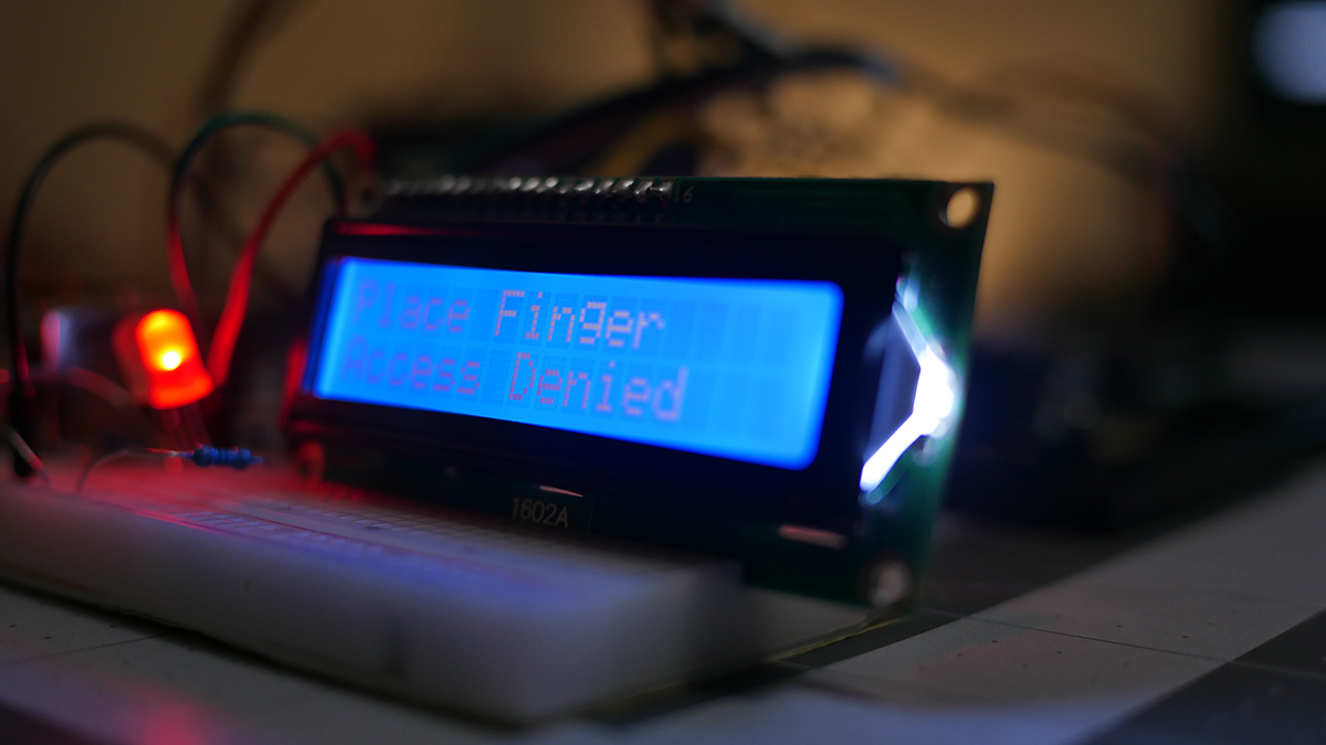 LCD displaying Place Finger / Access Denied with Red LED lit